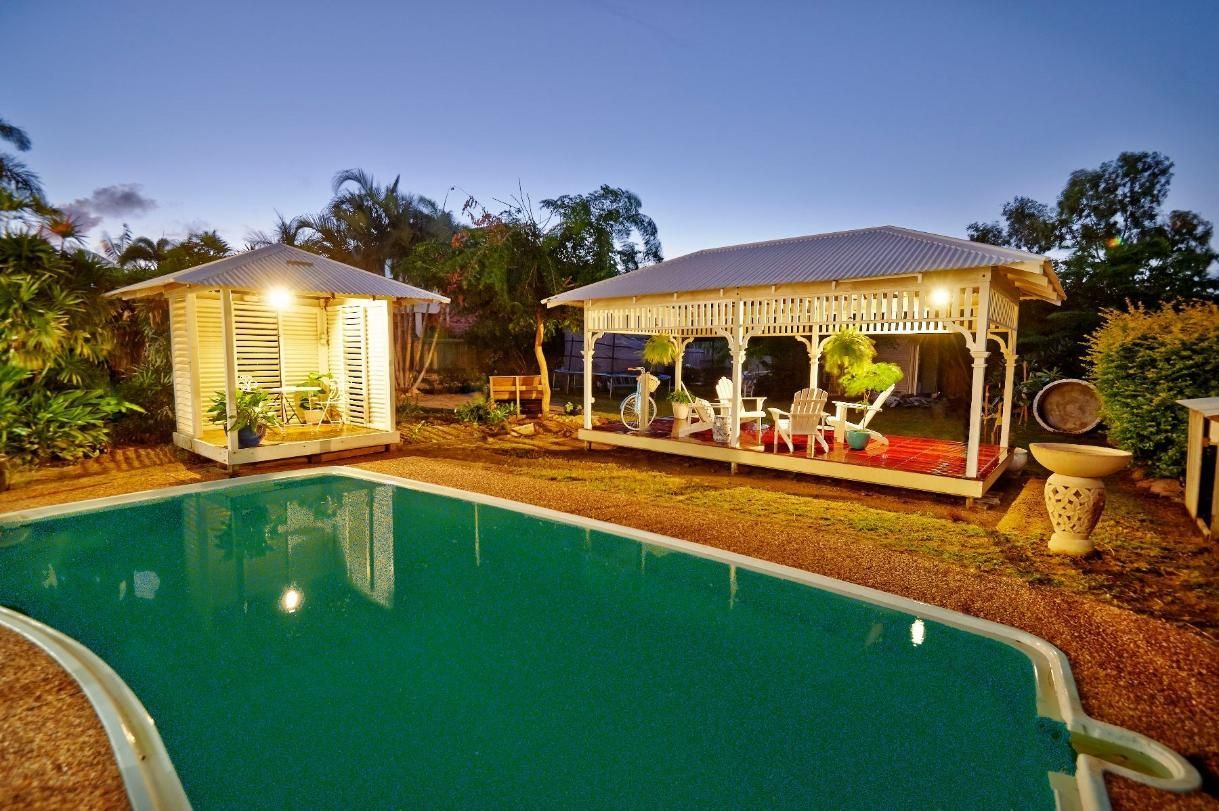 A Large Swimming Pool With a Gazebo in the Background — Pro-Jax Pty Ltd in Bohle, QLD