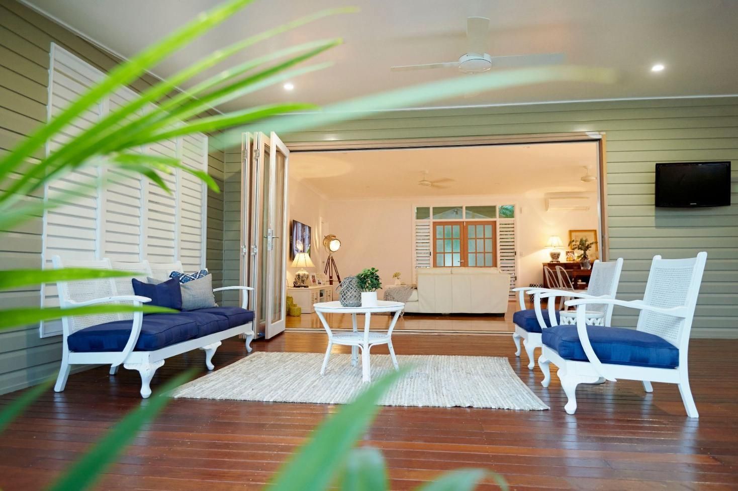 A Living Room With a Couch, Chairs, Table and Television — Pro-Jax Pty Ltd in Bohle, QLD