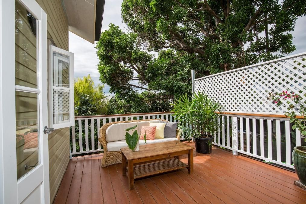 A Deck With a Couch and a Table on It — Pro-Jax Pty Ltd in Bohle, QLD