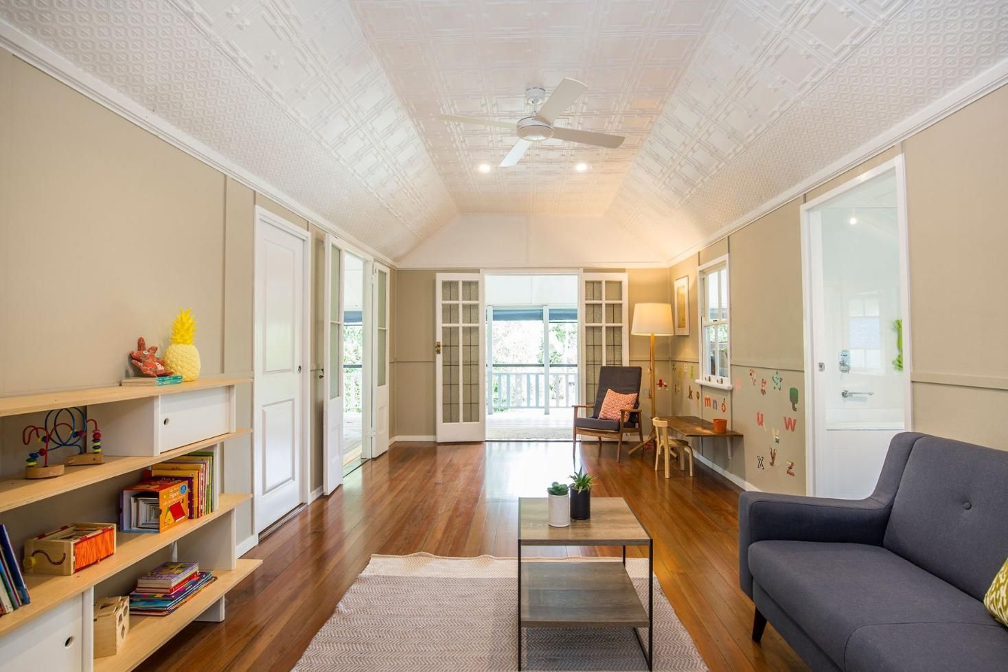 A Living Room With a Couch, Table, Chairs and a Ceiling Fan — Pro-Jax Pty Ltd in Bohle, QLD