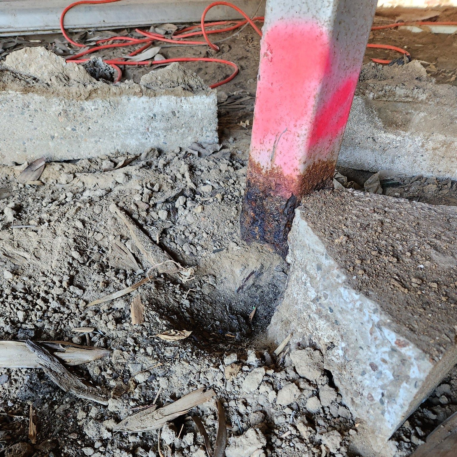 Concrete Post With Red Paint Marking — Pro-Jax Pty Ltd in Bohle, QLD