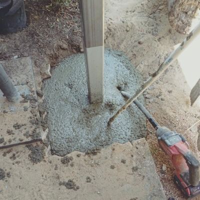 Concrete Poured Around a Metal Post, Soil Surrounding — Pro-Jax Pty Ltd in Bohle, QLD