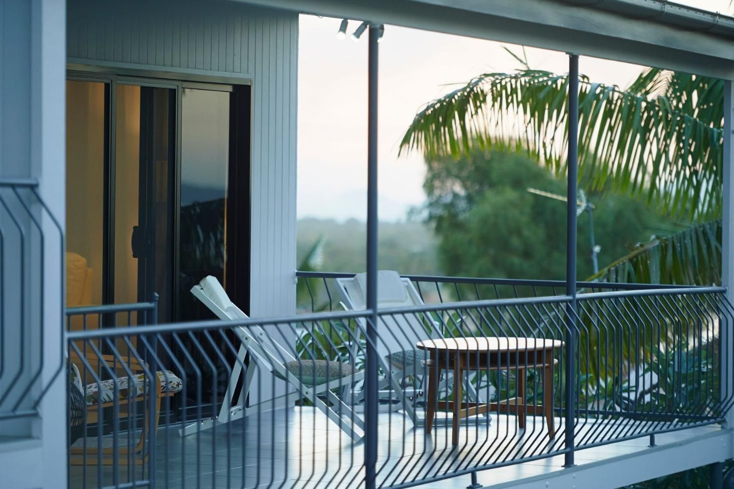 A Balcony With Chairs and a Table on It — Pro-Jax Pty Ltd in Bohle, QLD
