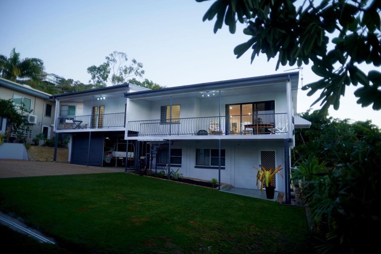 A Large White House With a Lot of Windows and Balconies — Pro-Jax Pty Ltd in Bohle, QLD