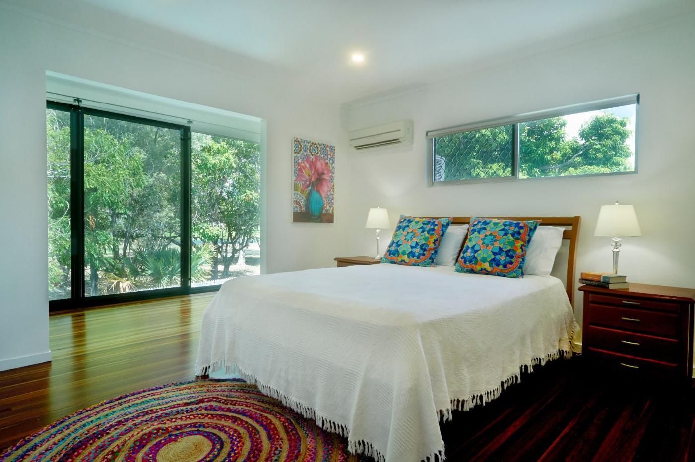 A Bedroom With a King Size Bed, Nightstands, and a Rug — Pro-Jax Pty Ltd in Bohle, QLD