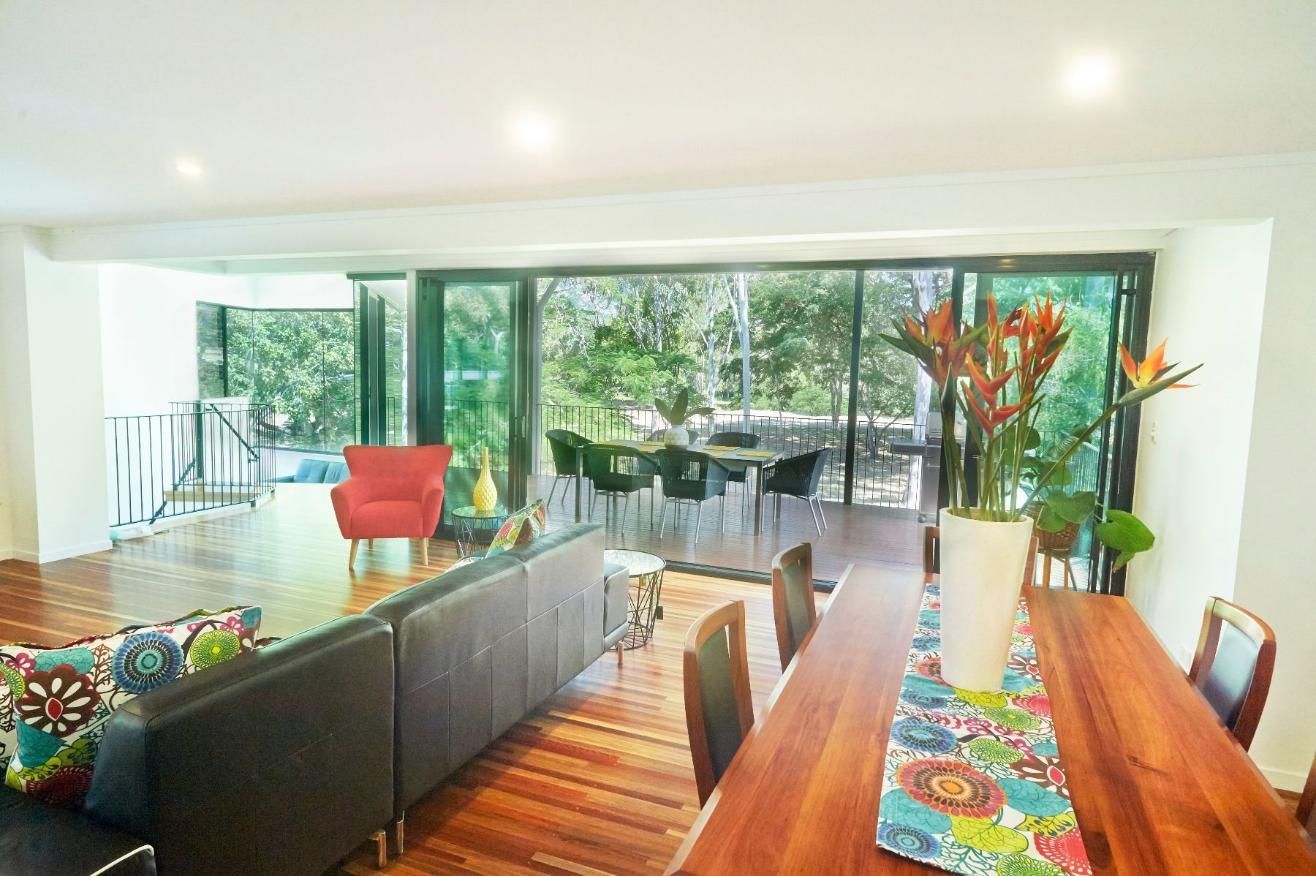A Living Room With a Dining Table and a Couch — Pro-Jax Pty Ltd in Bohle, QLD