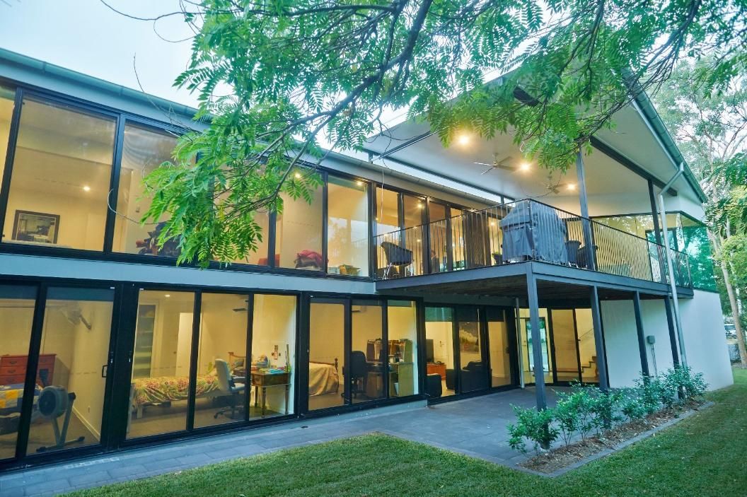 A Large House With a Lot of Windows and a Balcony — Pro-Jax Pty Ltd in Bohle, QLD
