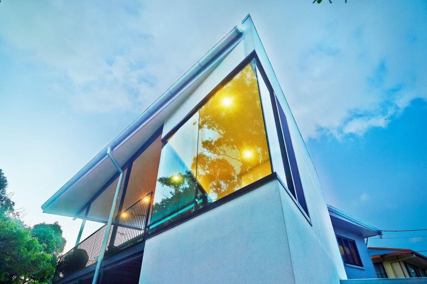 A House With a Lot of Windows and a Blue Sky in the Background — Pro-Jax Pty Ltd in Bohle, QLD