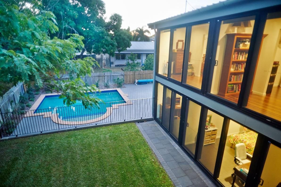 A Large House With a Swimming Pool in the Backyard — Pro-Jax Pty Ltd in Bohle, QLD