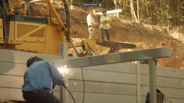 A Construction Worker Welds Metal Beams on a Retaining Wall — Pro-Jax Pty Ltd in Bohle, QLD
