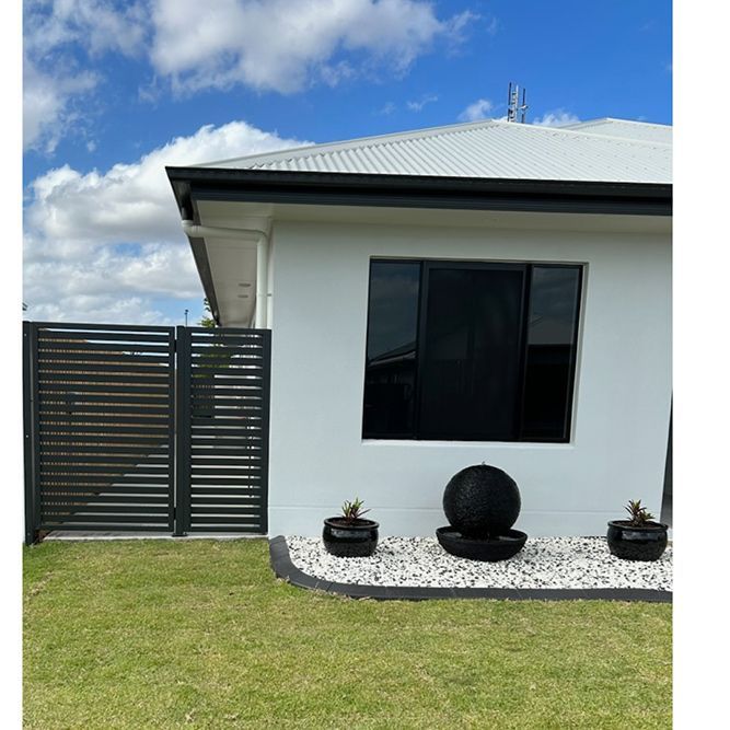 A Modern White House With a Black Window — Pro-Jax Pty Ltd in Bohle, QLD