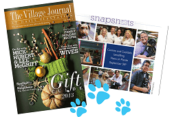 A magazine called the village journal is next to a magazine called gift guide 2013