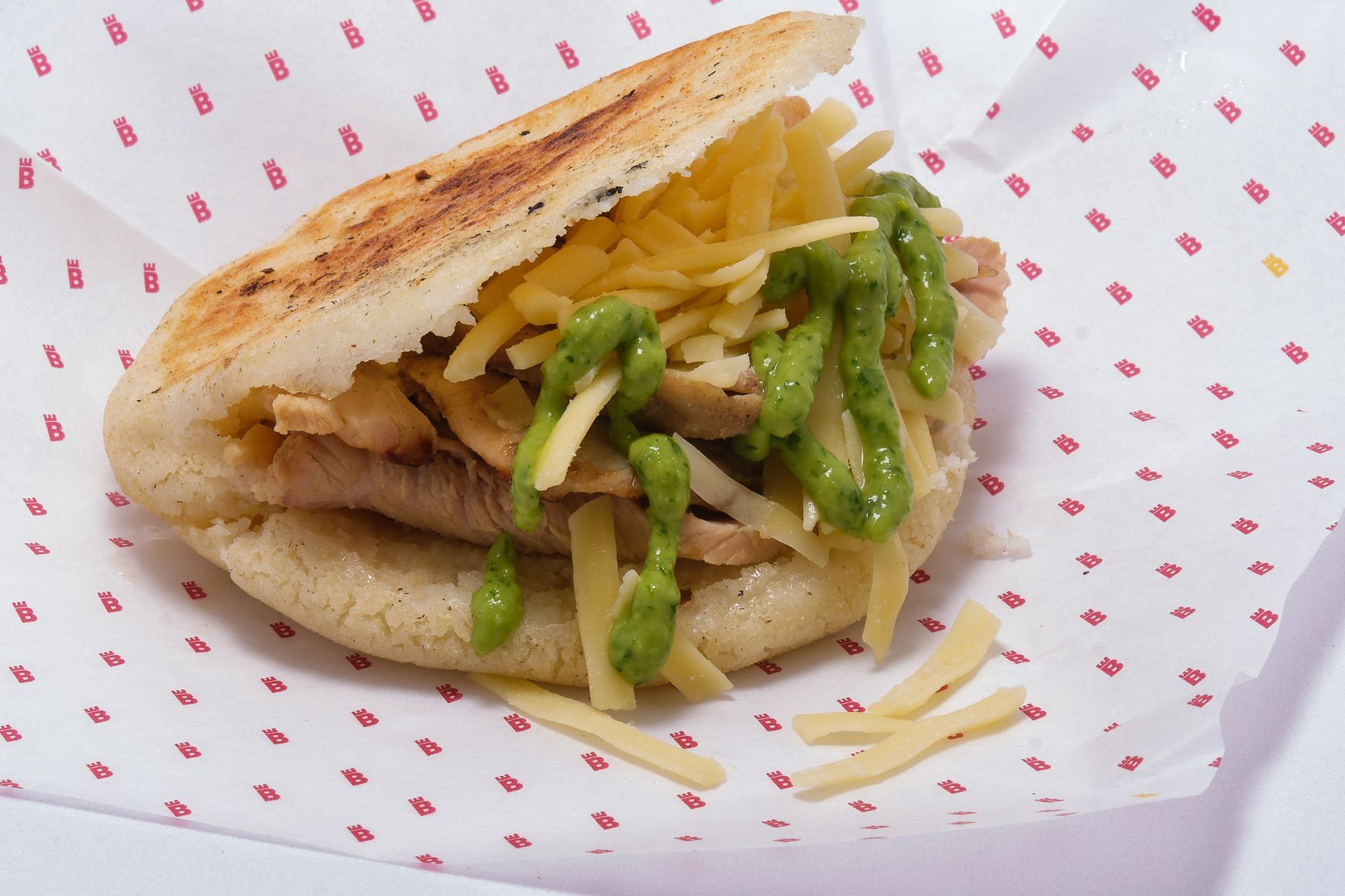 a close up of a sandwich on a piece of paper