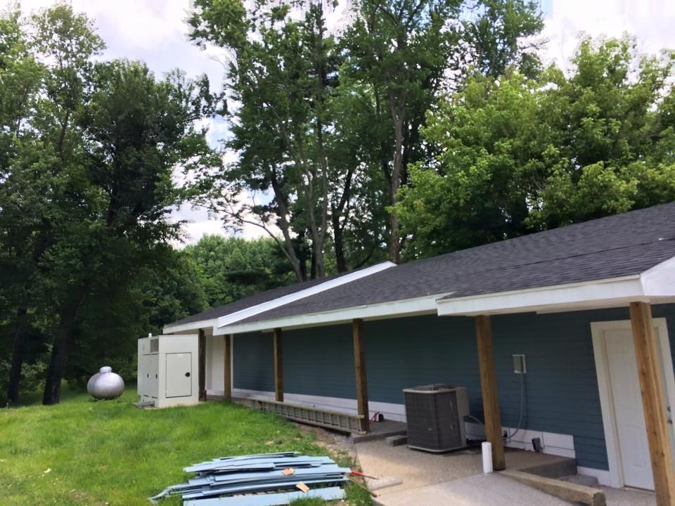 new roof on blue house