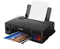 Impresora de inyección de tinta Canon imprimiendo una fotografía en color.