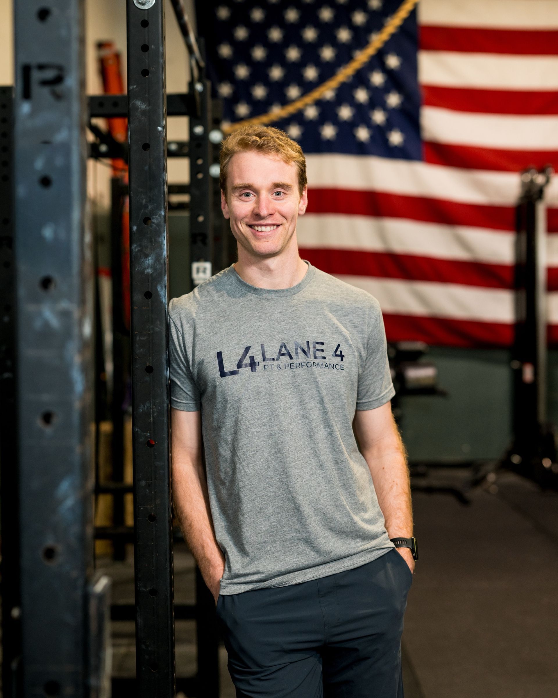 A group of people are running on a track.