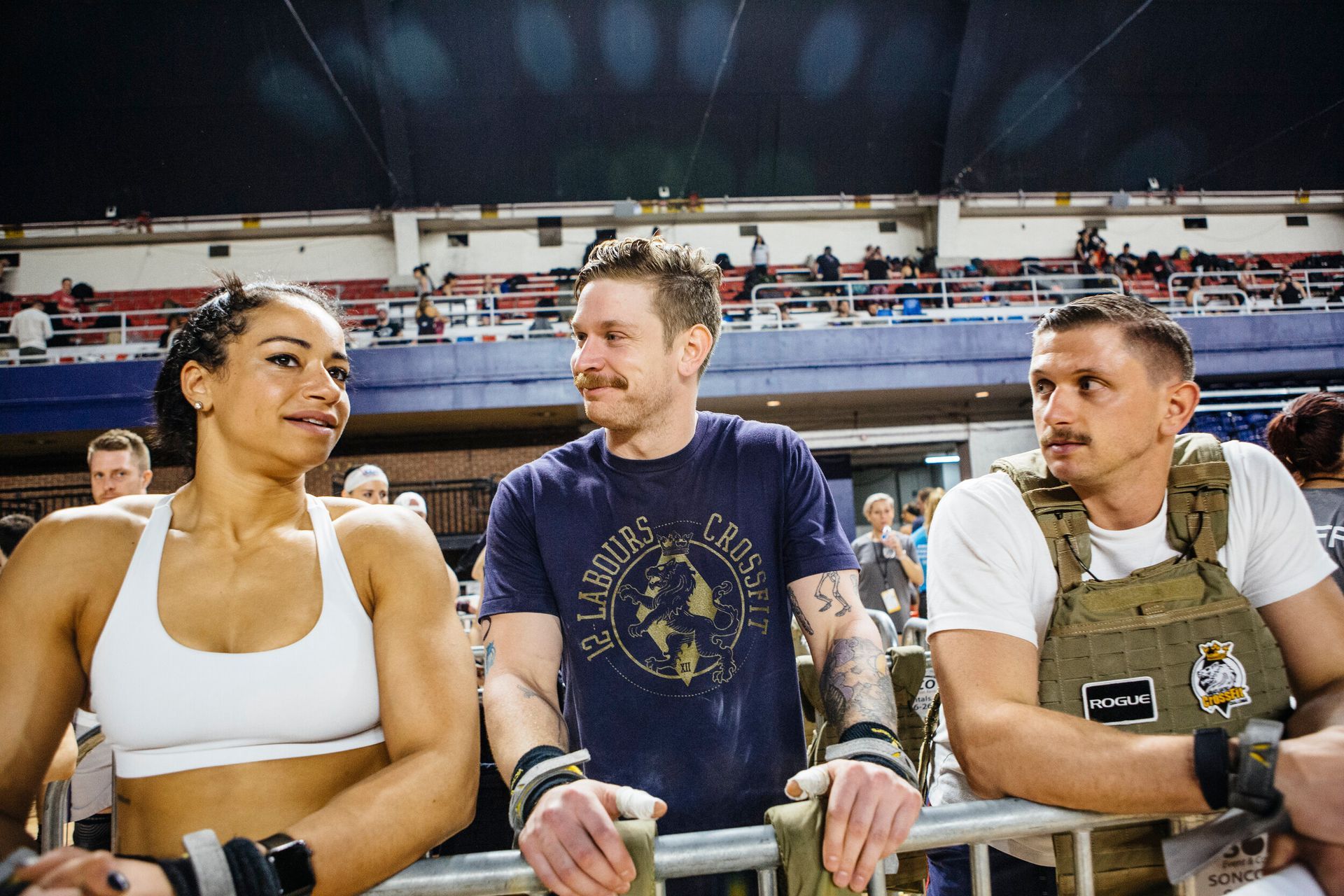 A group of people are sitting next to each other in a stadium.