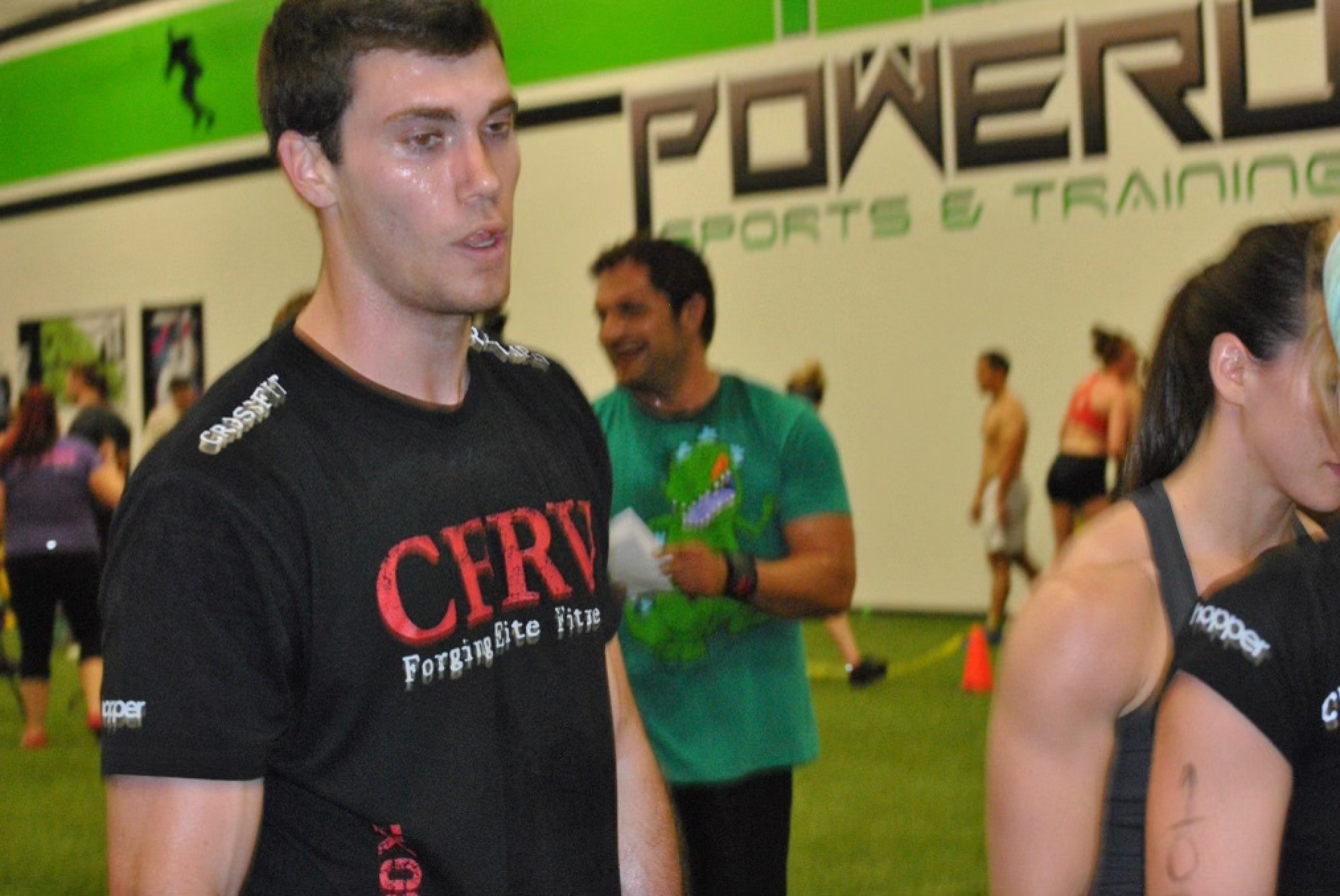 A man wearing a black shirt that says cerv on it