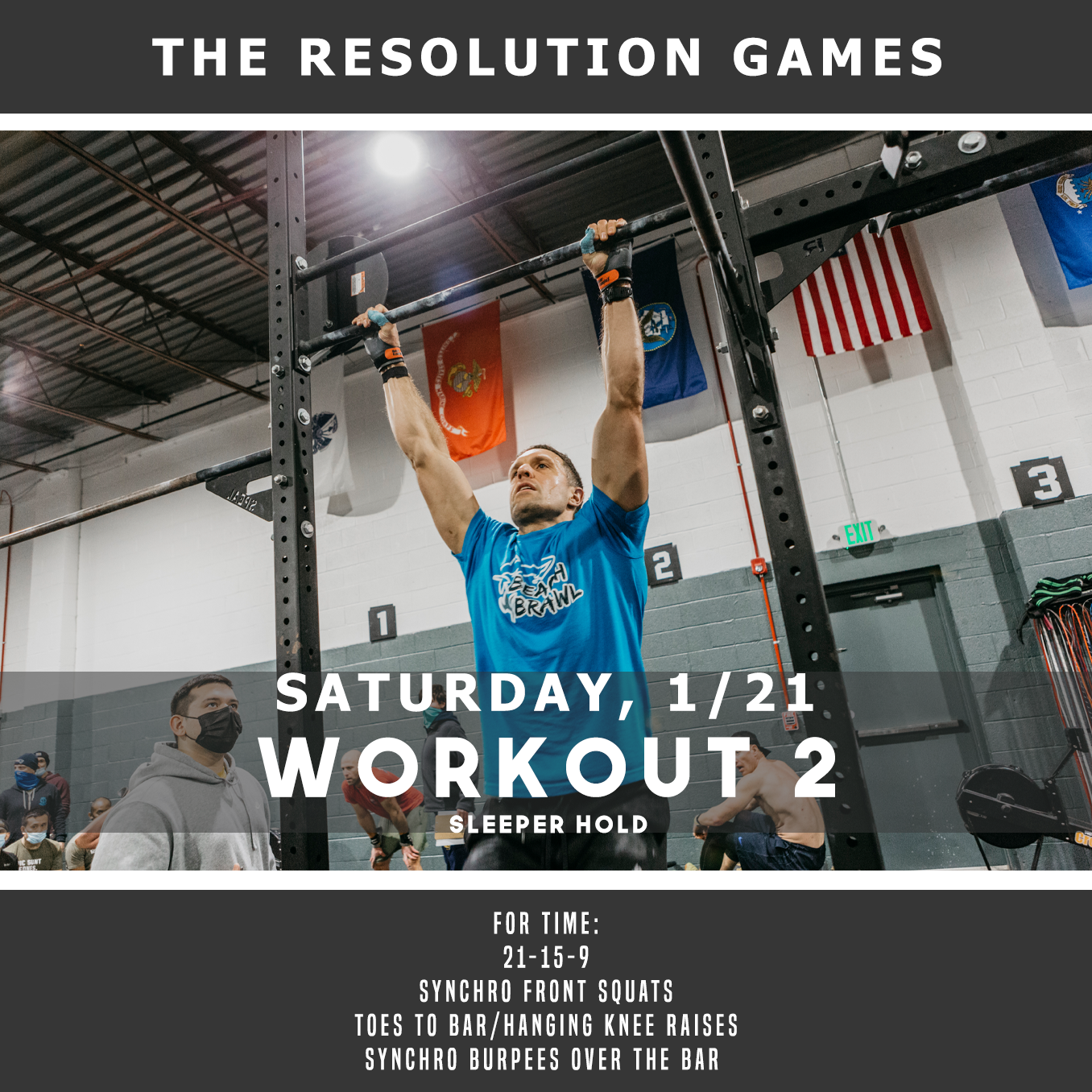 A man is doing a pull up on a bar in a gym.