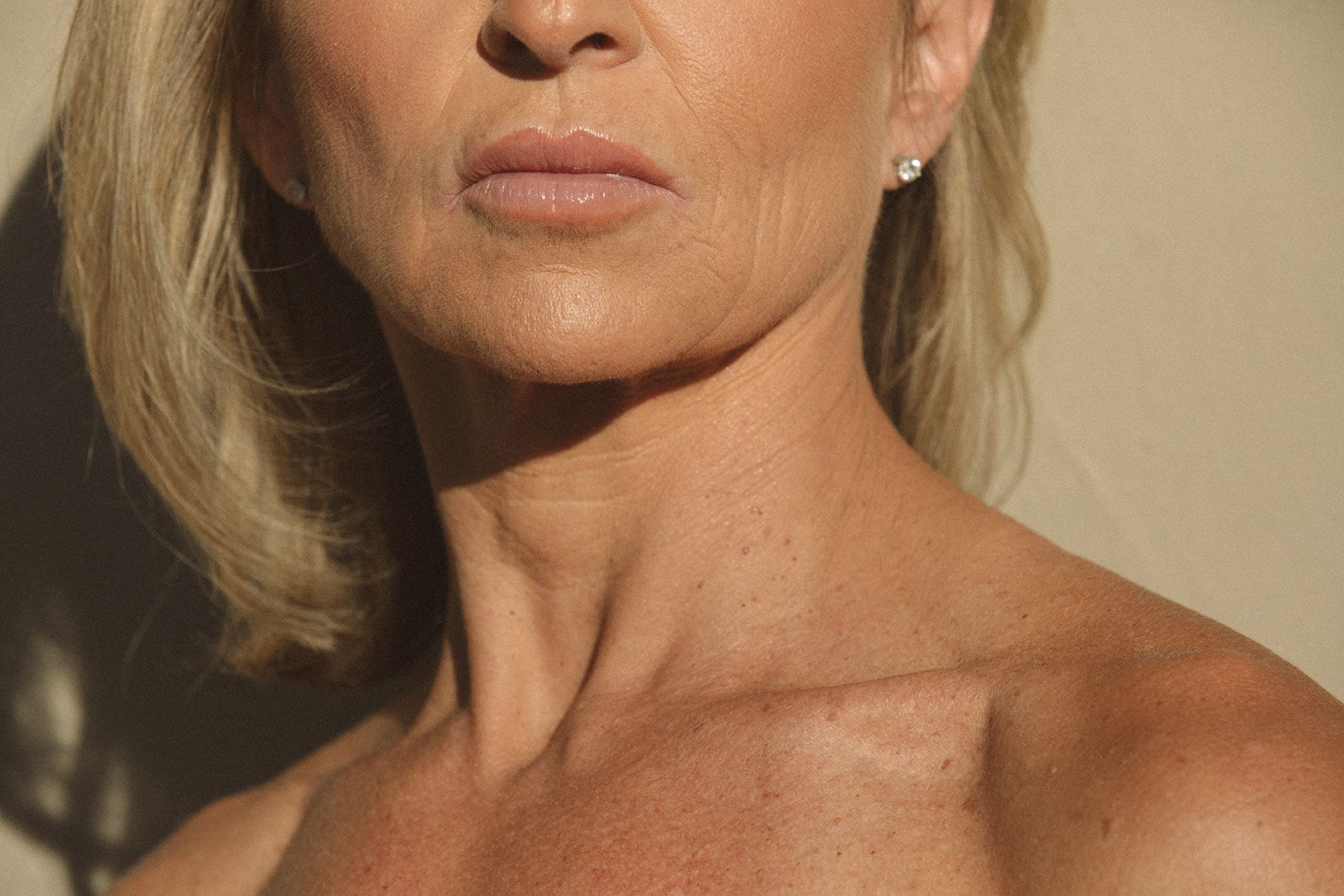 A close up of a woman 's neck and chest.
