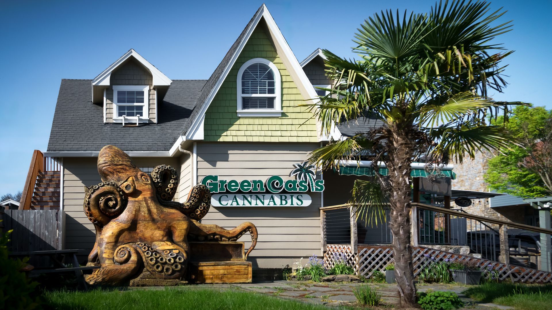 A house with a statue of an octopus in front of it