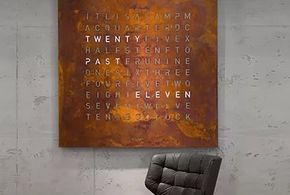 leather chair, concrete wall with square bronze artwork