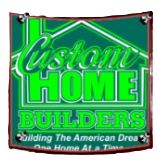 A sign with a house outline and bright green text reading