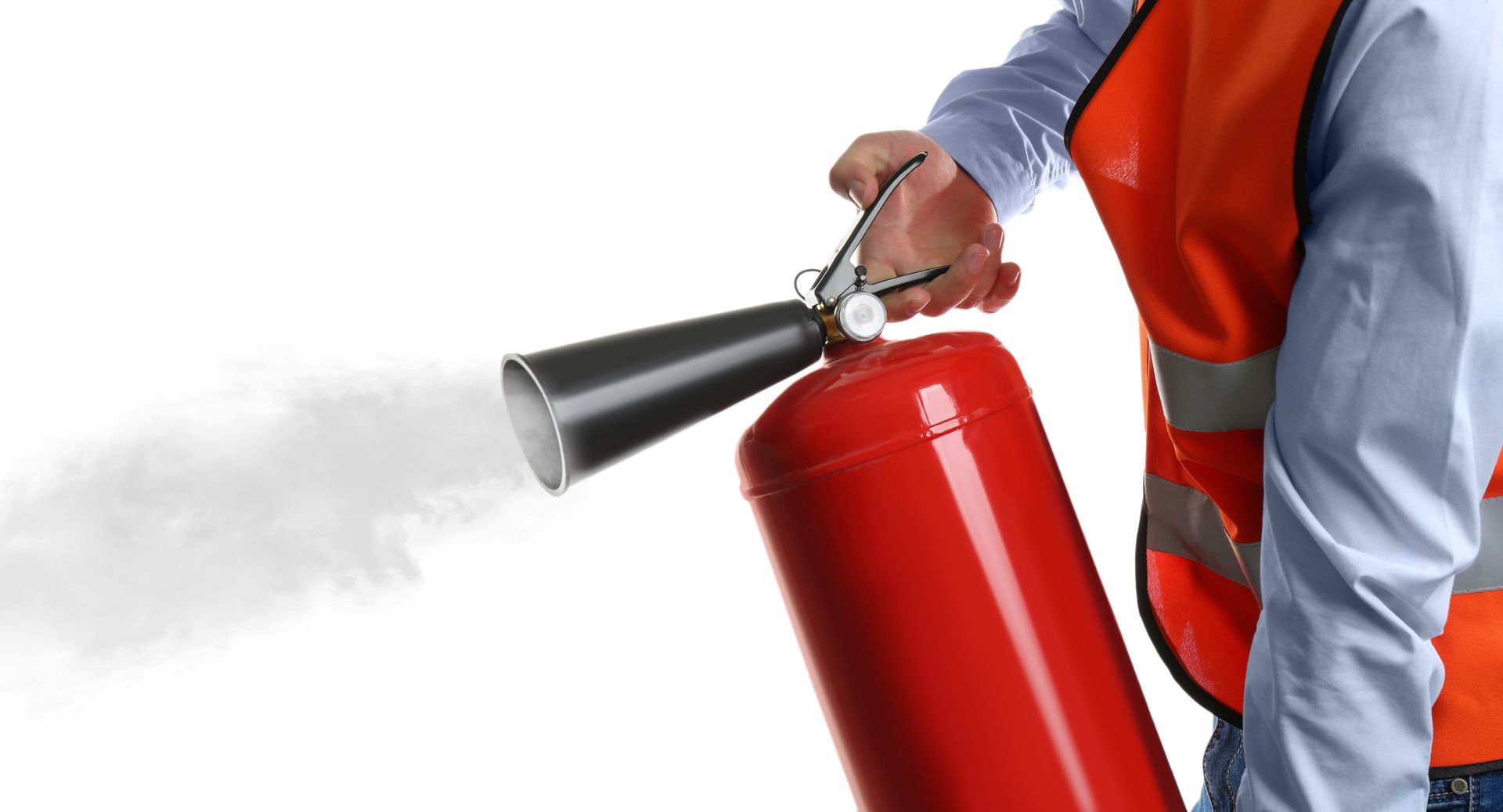 Worker using fire extinguisher on white background.