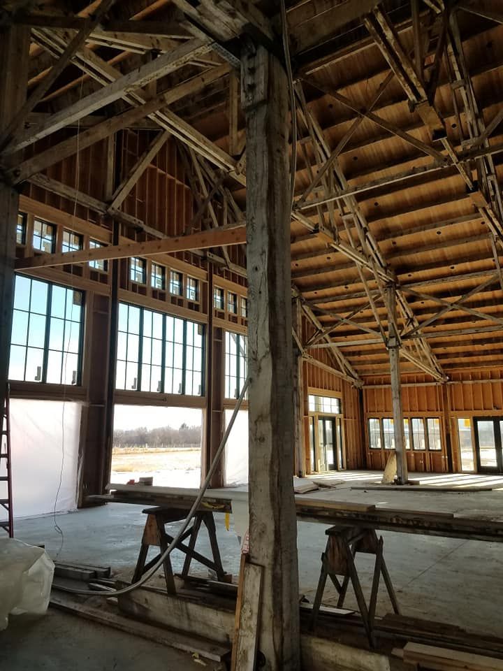 A building with a wooden roof and a wooden door.