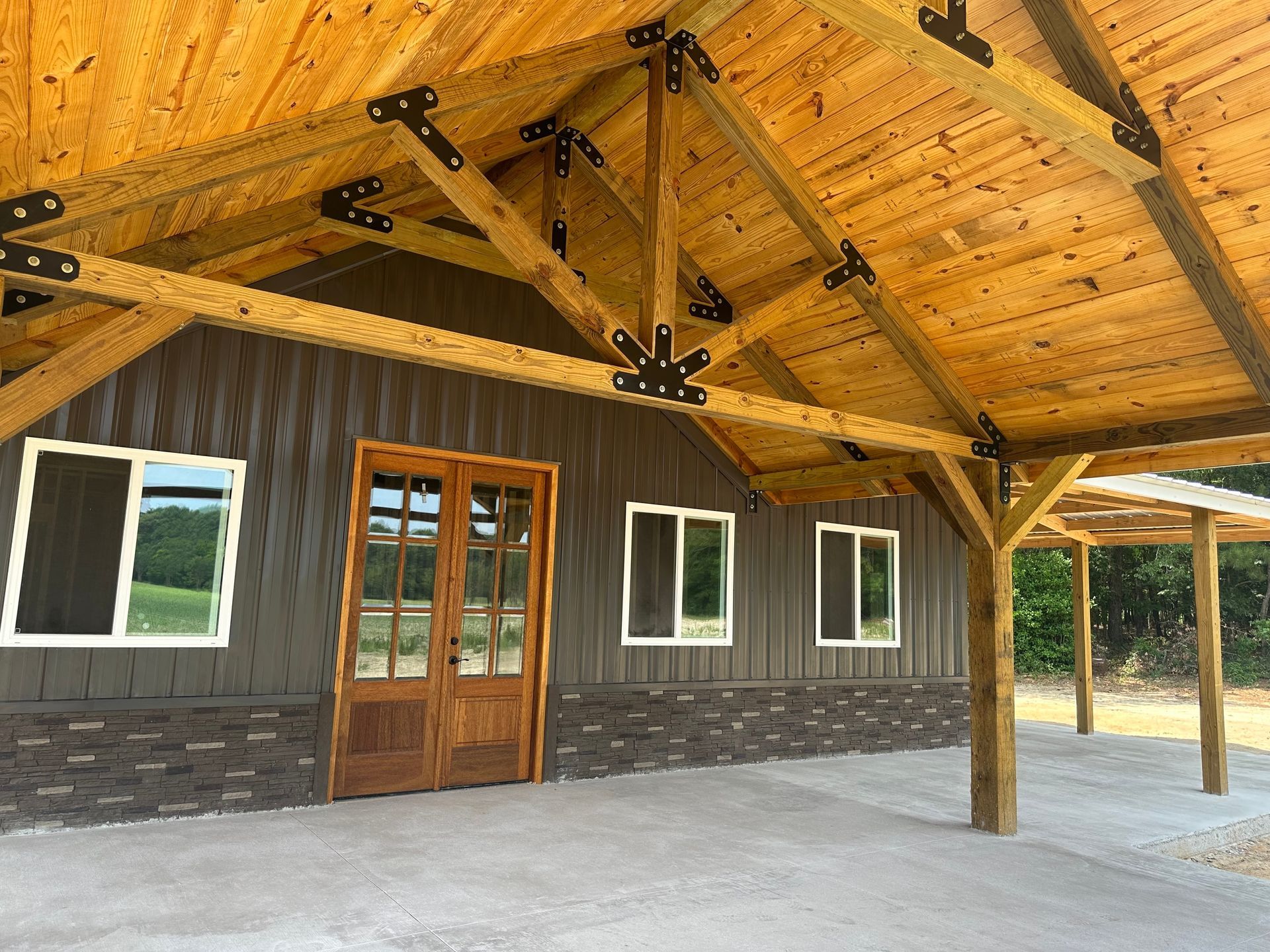 A building with a wooden roof and a wooden door.