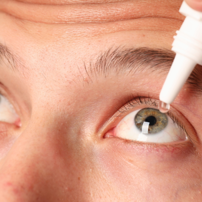 What are the best eye drops for dry eyes? Image of a man using eye drops