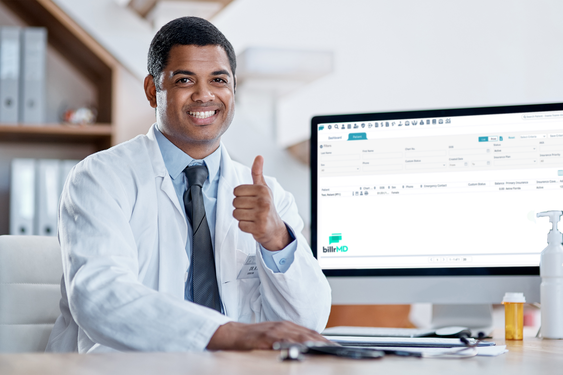 A doctor doing the thumbs up gesture while an e-invoicing software is displayed on a computer screen.