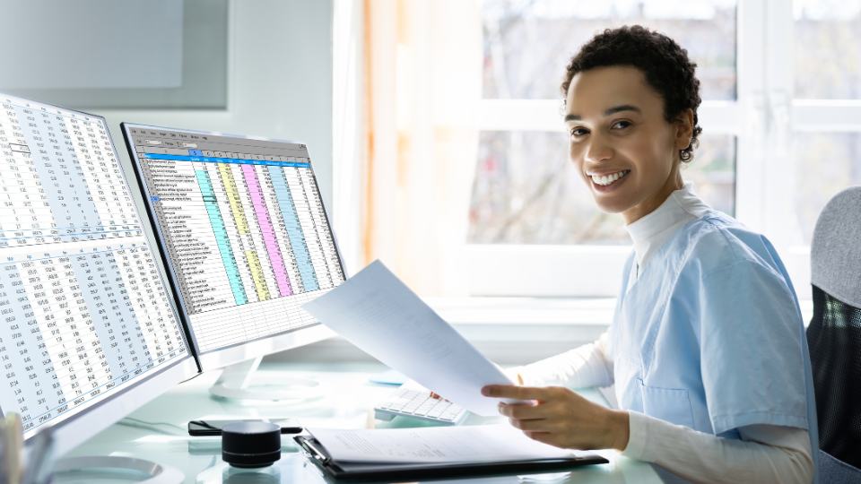 A staff member uses billrMD billing & practice management software to streamline processes & profit.