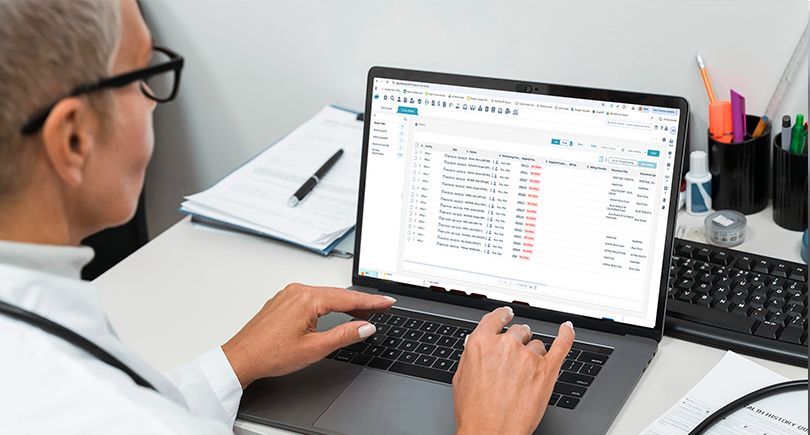 A medical biller reviewing FY 2026 ICD-10-CM guideline updates using billrMD’s medical billing automation tools