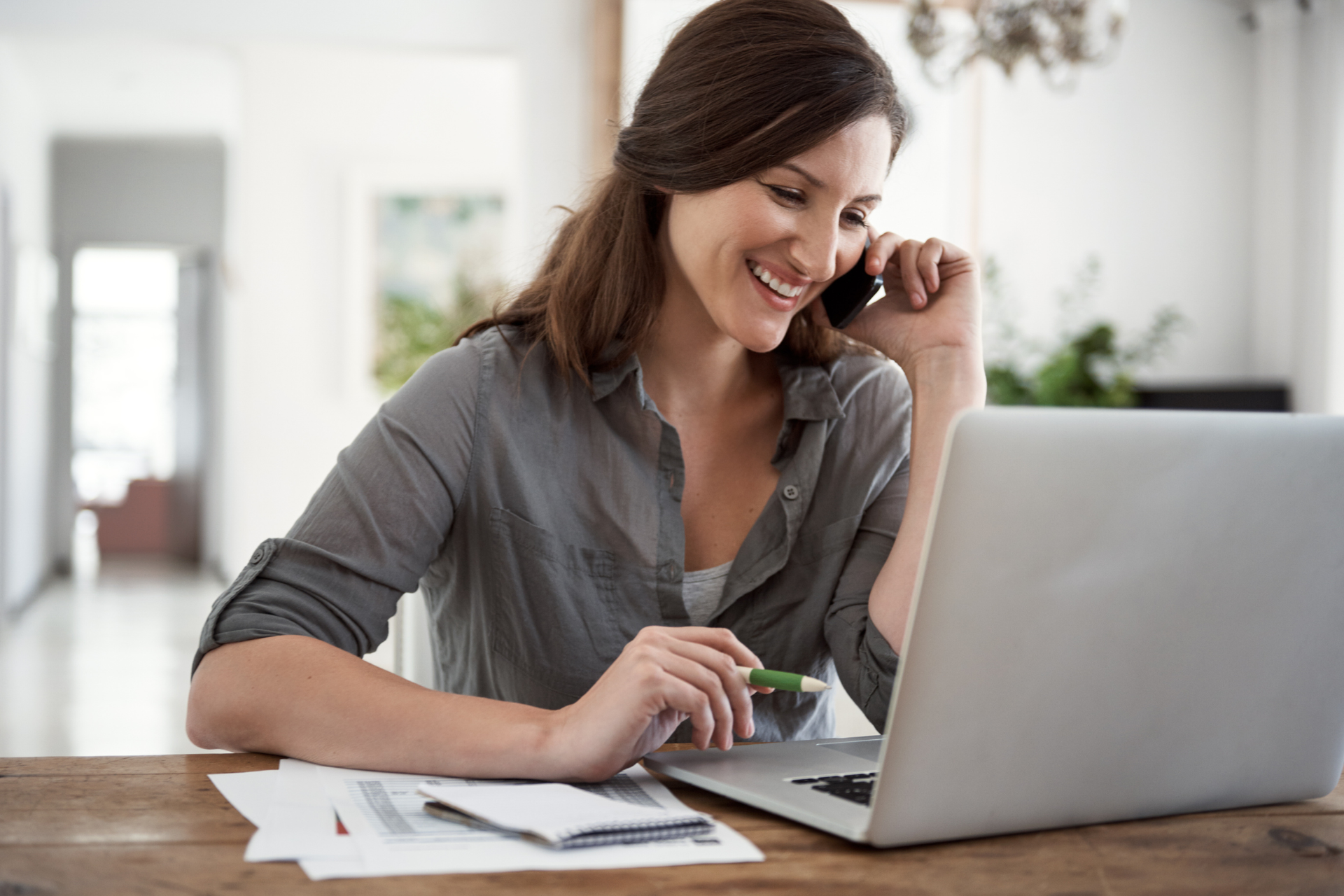 A healthcare staff member coordinating with a software vendor over the phone for denial management solutions