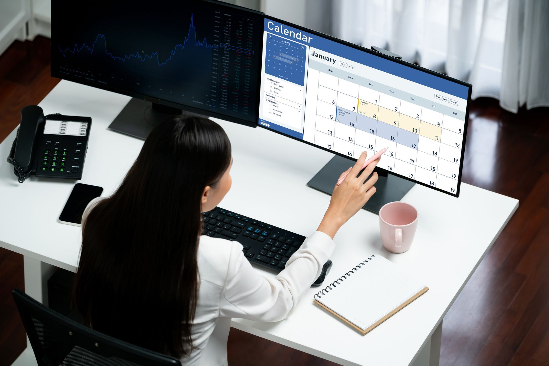 An administrative staff member manages clinic appointments using an interactive scheduling system.