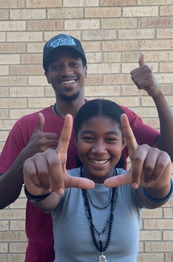 Person serving food to another person at a food bank.