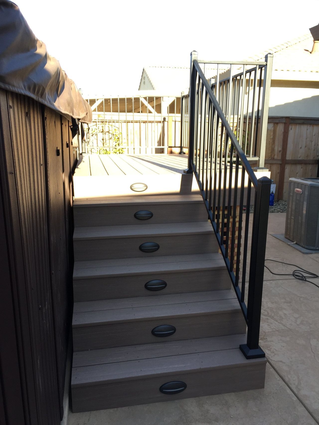 A set of stairs leading up to a hot tub