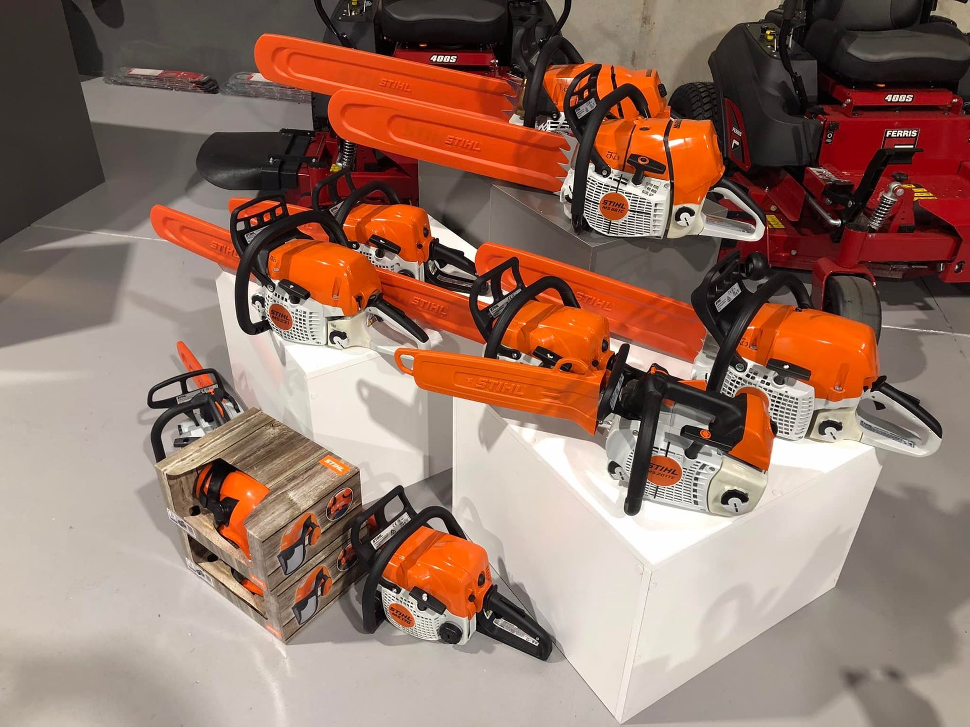 A Bunch of Chainsaws Are on Display on a Table — Coffs Chainsaw and Mower in Coffs Harbour, NSW