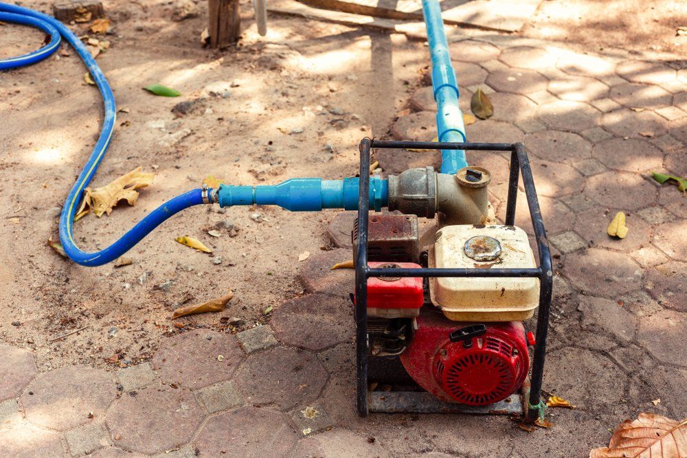 Water Pump On The Ground — Coffs Chainsaw and Mower in Coffs Harbour, NSW