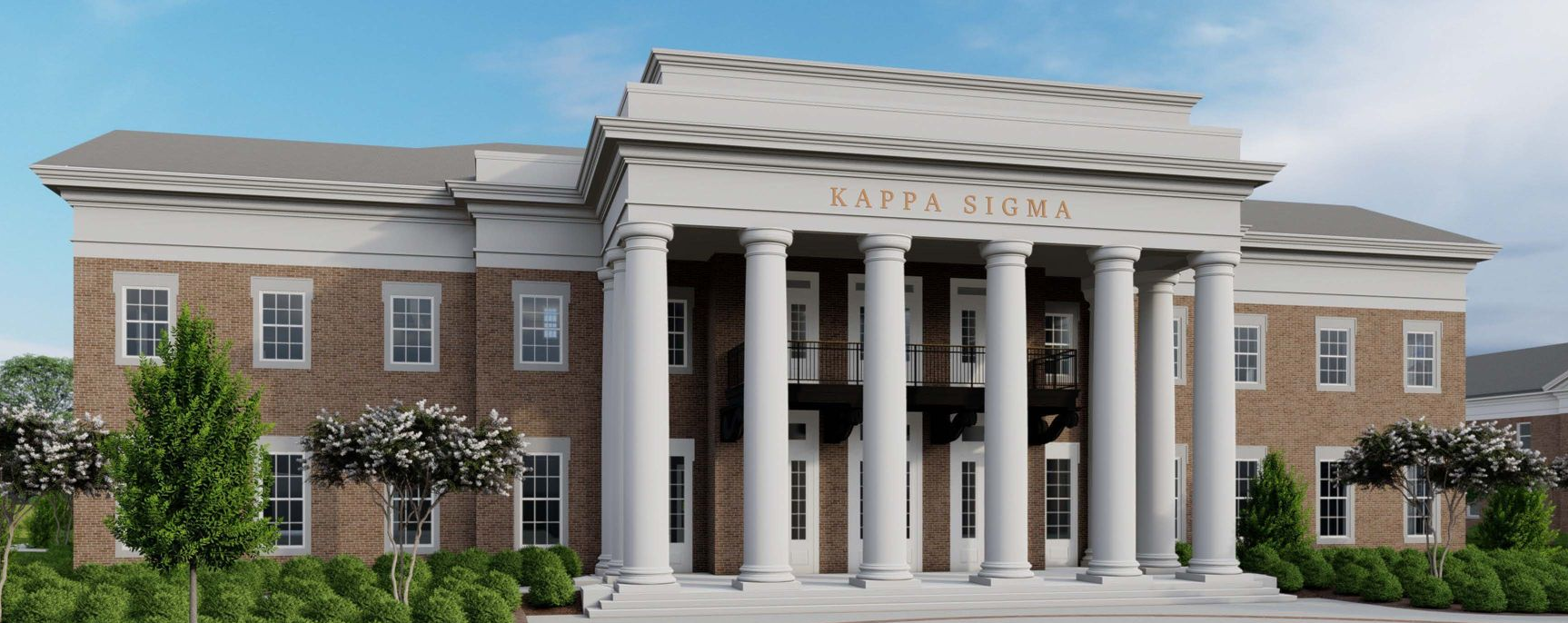 A brick building with white columns and the words 