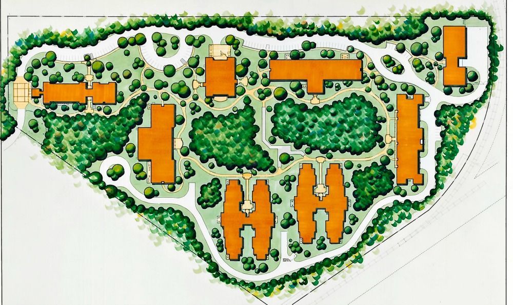Overhead view of a campus layout with orange buildings and green landscaping, pathways.