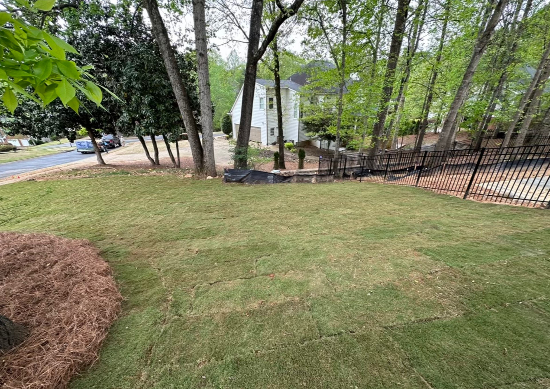 New sod installation by RC Landscapes enhancing a home's outdoor area.