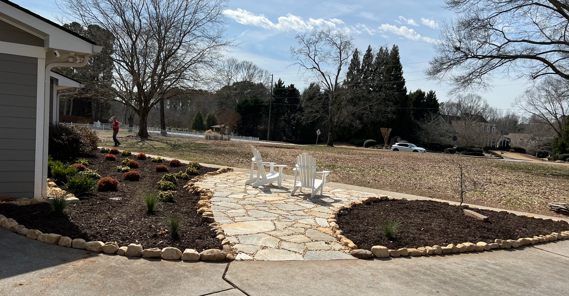 RC Landscapes' designed stone patio with integrated landscaping features.