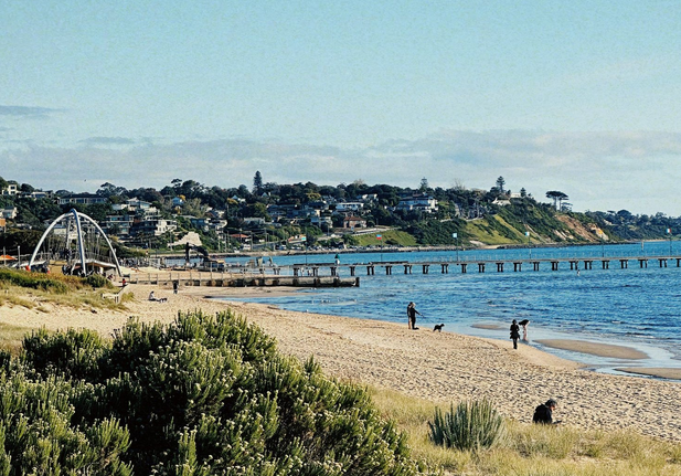 Frankston beach on sunny autumn day looking from sand hills south to pier and Olivers Hill