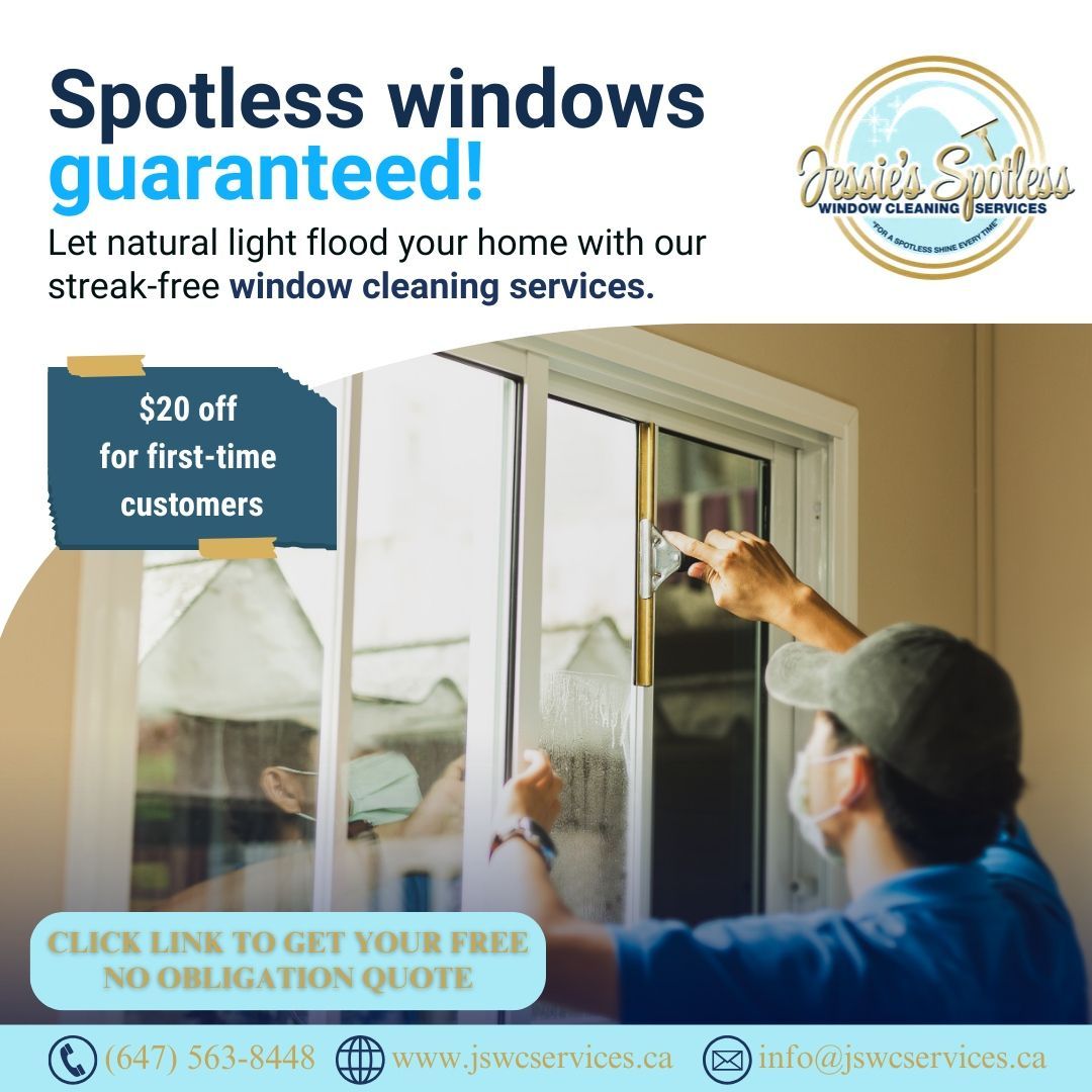 A man is cleaning a window with the words spotless windows guaranteed