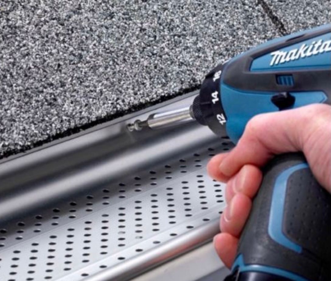 A person is using a makita cordless drill