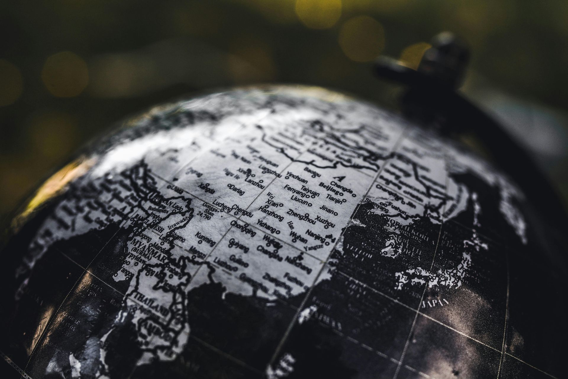 A close up of a globe with a map of the world on it.