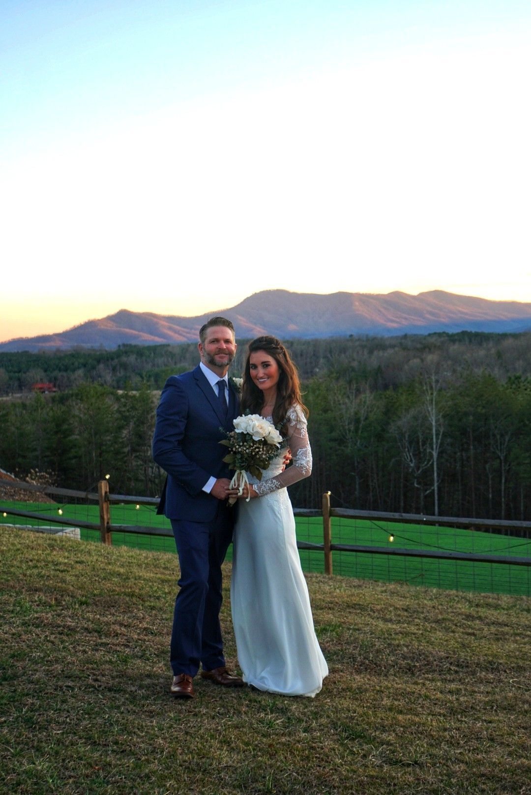 Couple sharing a quiet moment at sunset during their private mountain elopement at Serenity Ridge.