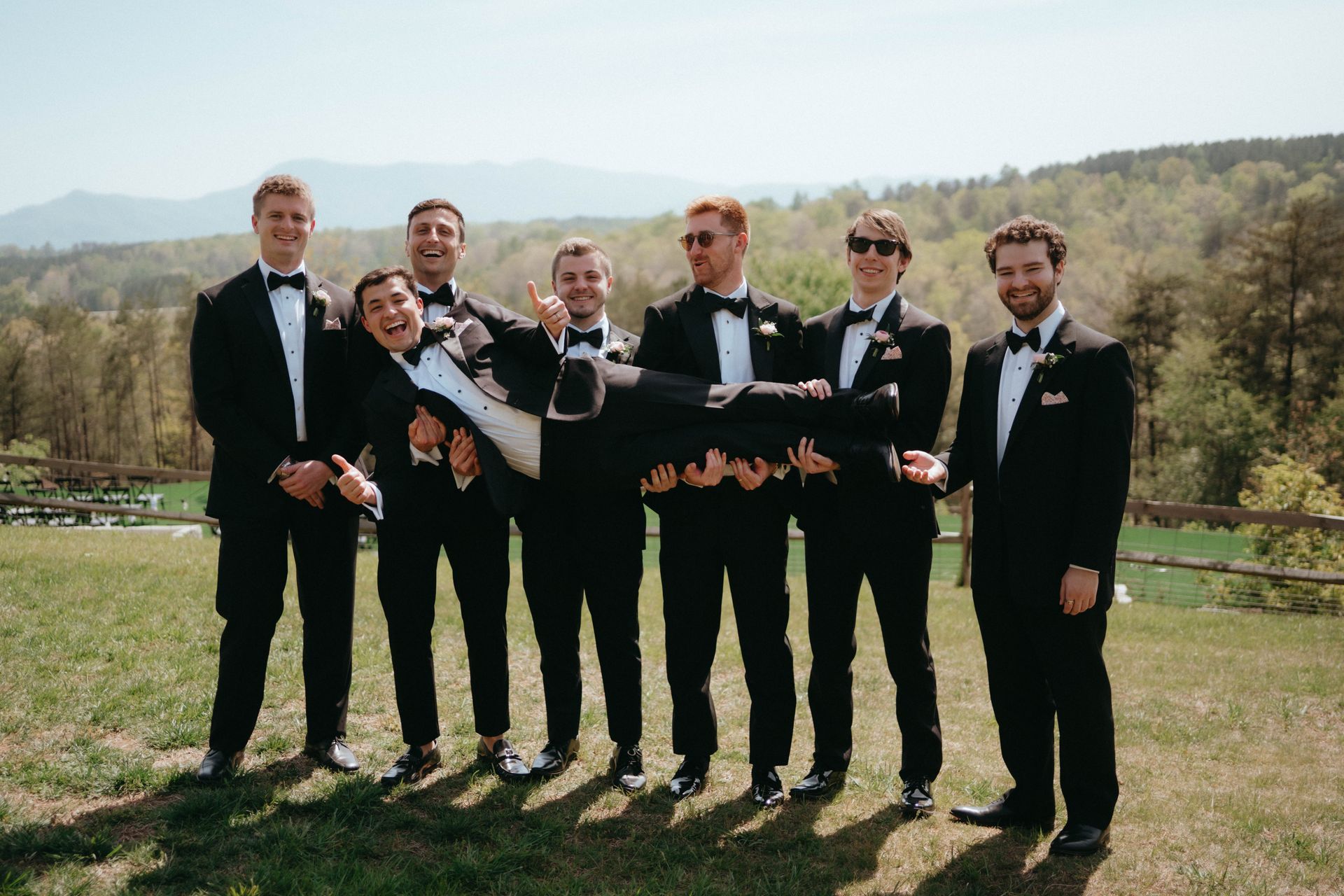 Groomsmen posing together before mountain wedding ceremony in western North Carolina